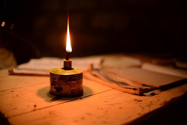 A home lit with a kerosene lamp
